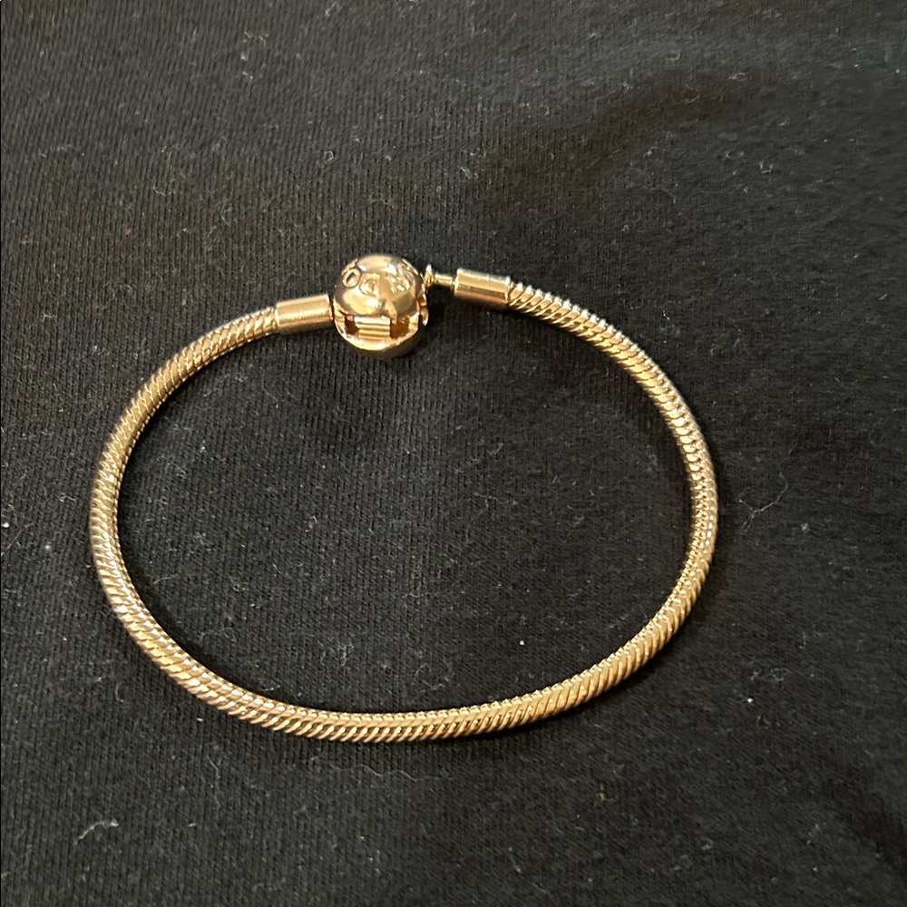 Pandora 14k rose gold plating. Bracelet- 7 inches